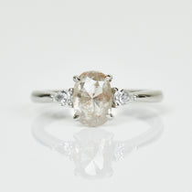 Platinum salt and pepper oval diamond engagement trilogy ring