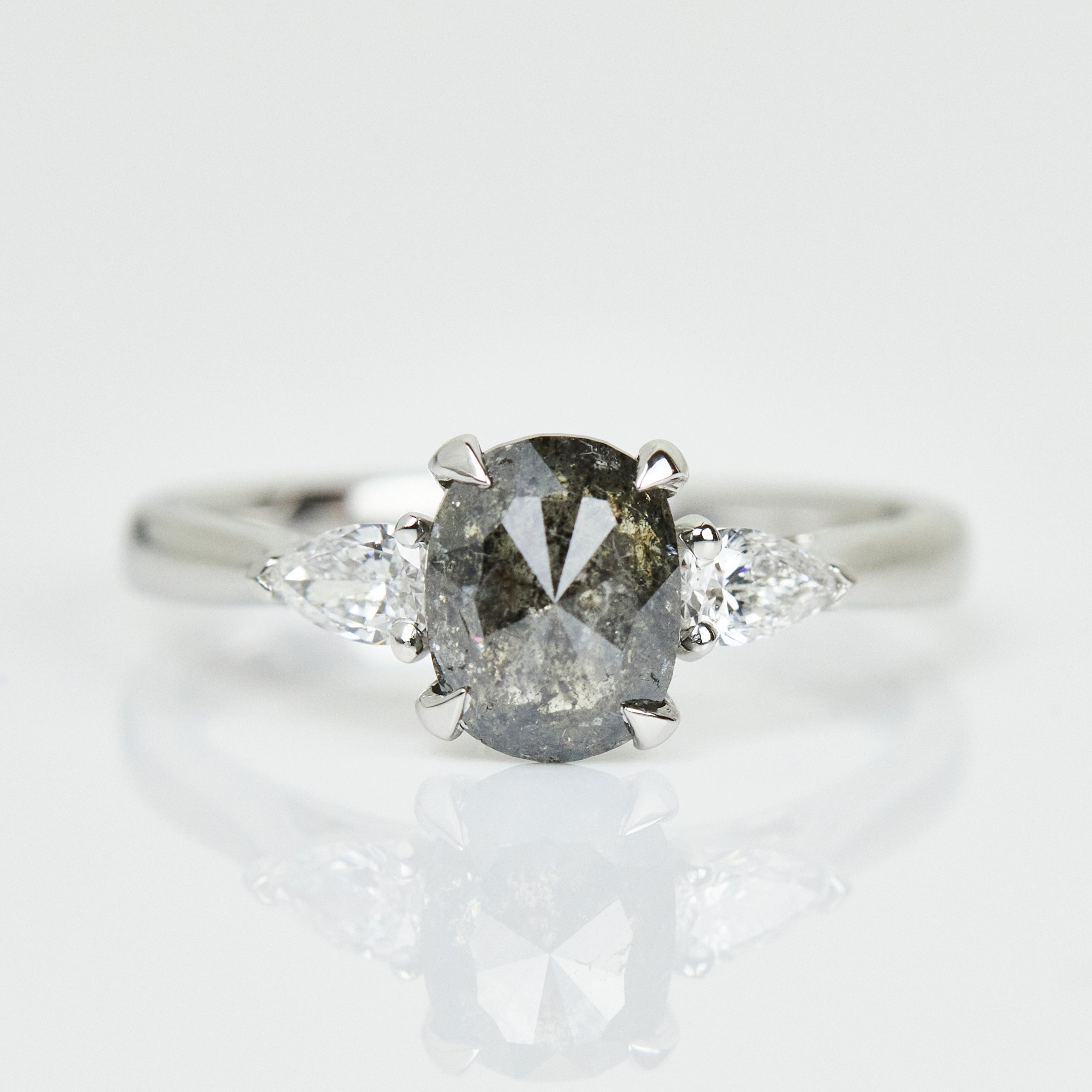 Platinum salt and pepper oval diamond engagement trilogy ring