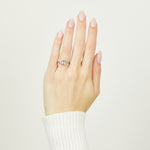Platinum salt and pepper oval diamond engagement trilogy ring