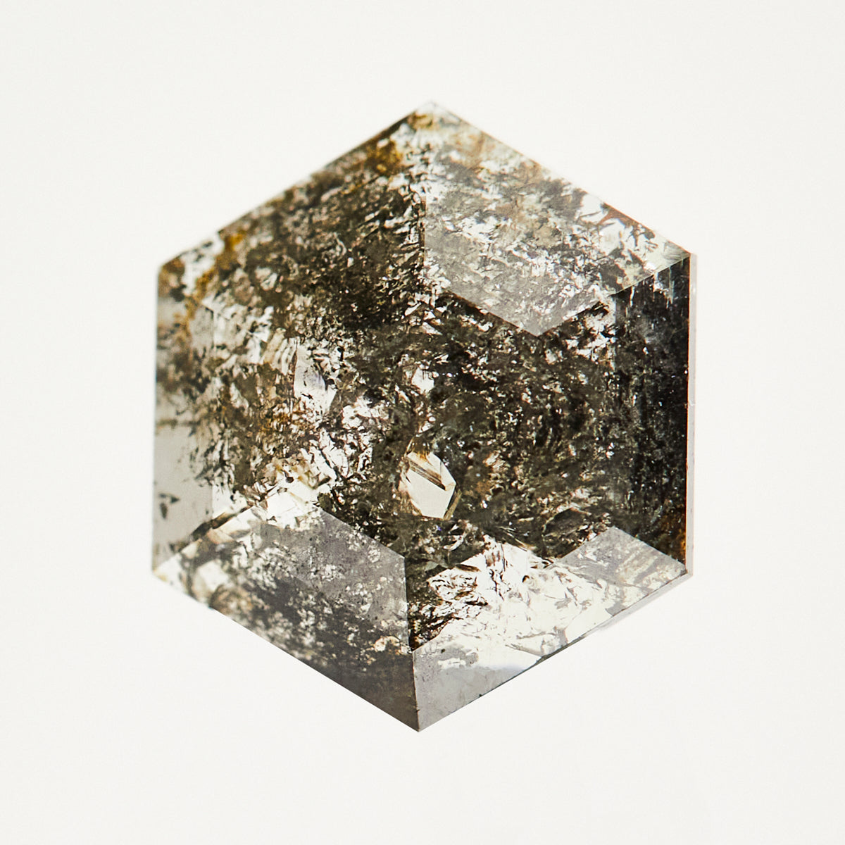 Dark and stormy hexagon rose-cut raw salt and pepper diamond.