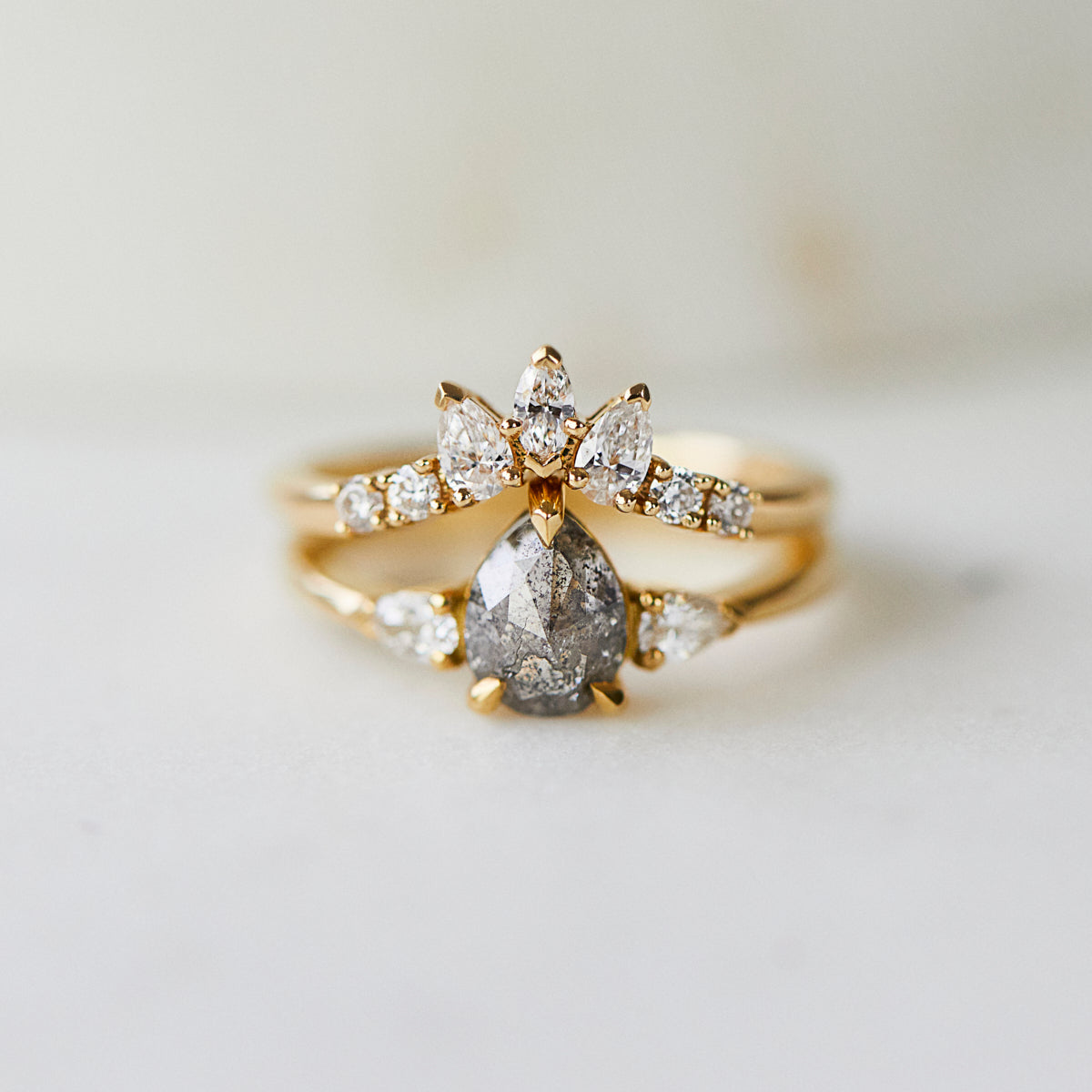 18ct yellow gold salt and pepper pear diamond engagement trilogy ring