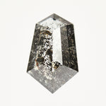 Modern elongated tapered hexagon rose-cut black salt and pepper diamond.