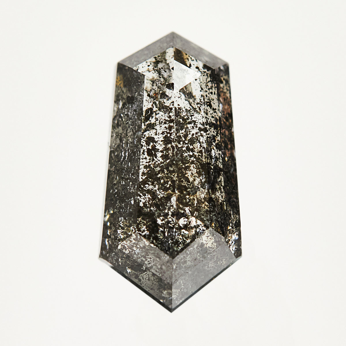Alternative elongated hexagon rose-cut dark gray salt and pepper diamond.