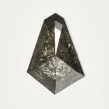 Handcrafted elongated tapered baguette rose-cut dark ethically sourced salt and pepper diamond.