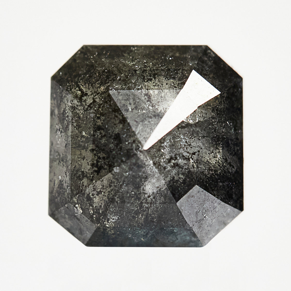 Alternative emerald-shaped rose-cut dark rustic salt and pepper diamond.