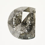 Alternative half-moon rose-cut dark rustic salt and pepper diamond.