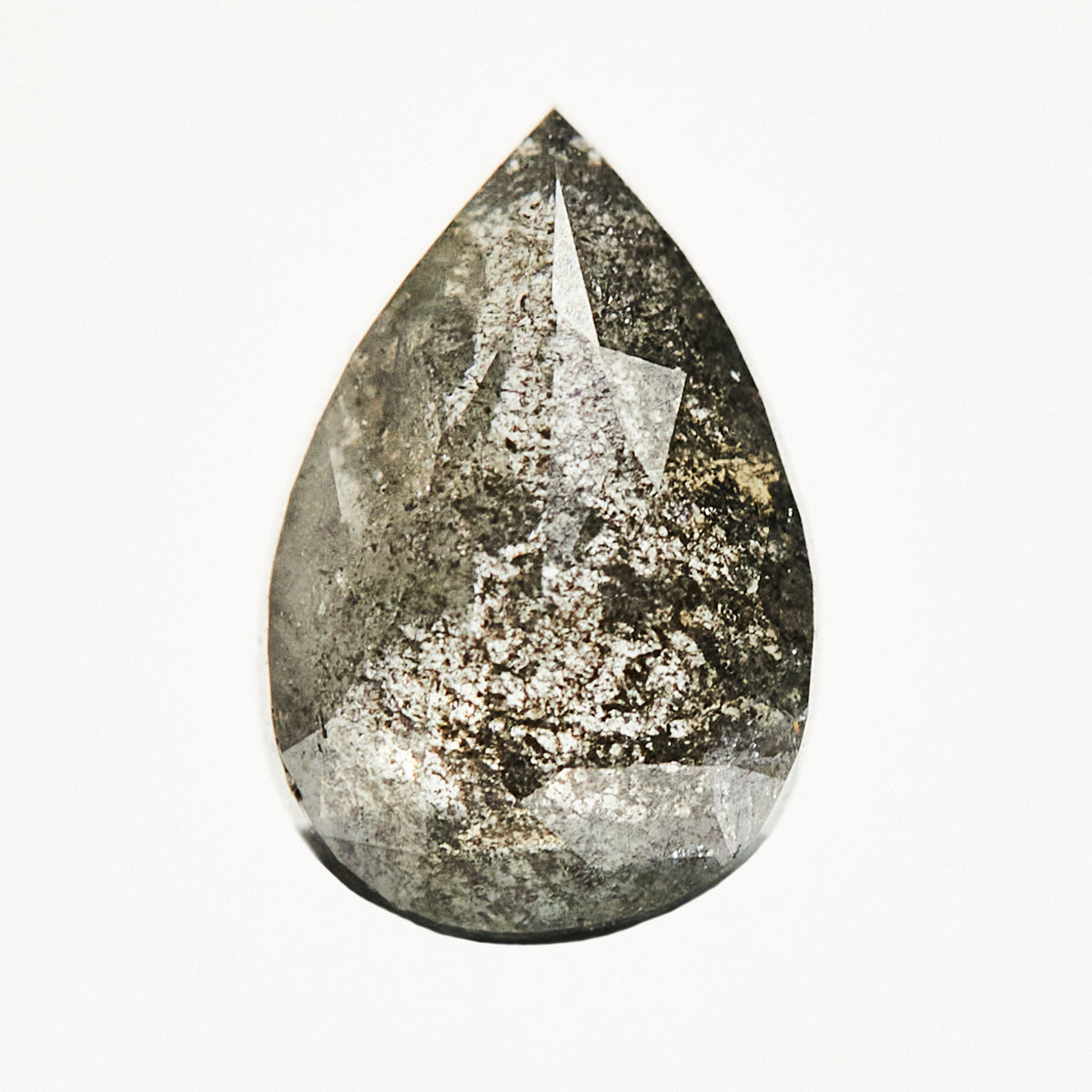 Dark pear-shaped rose-cut gray salt and pepper diamond.