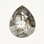 Dark pear-shaped rose-cut black salt and pepper diamond.