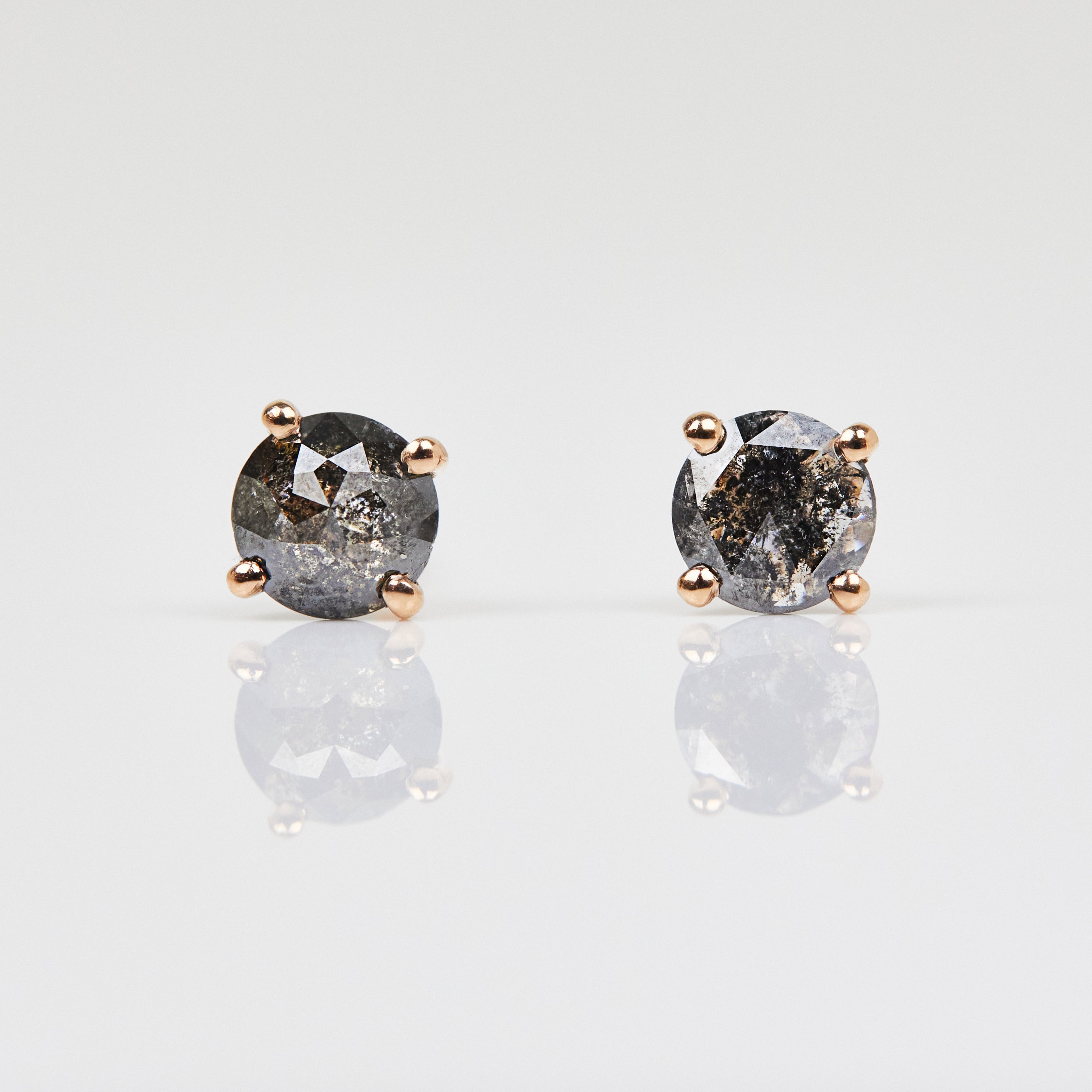 Dark and stormy salt and pepper diamond studs set in 18ct rose gold