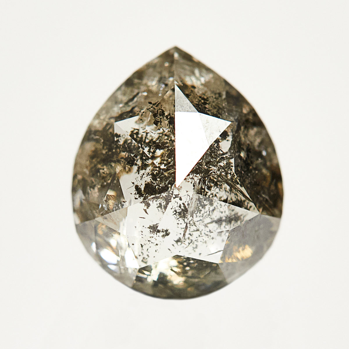 One-of-a-kind pear-shaped rose-cut dark grey salt and pepper diamond.