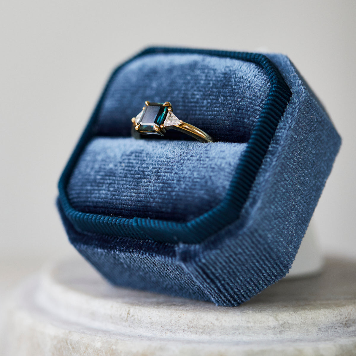 18ct yellow gold emerald cut trilogy ​teal sapphire rings