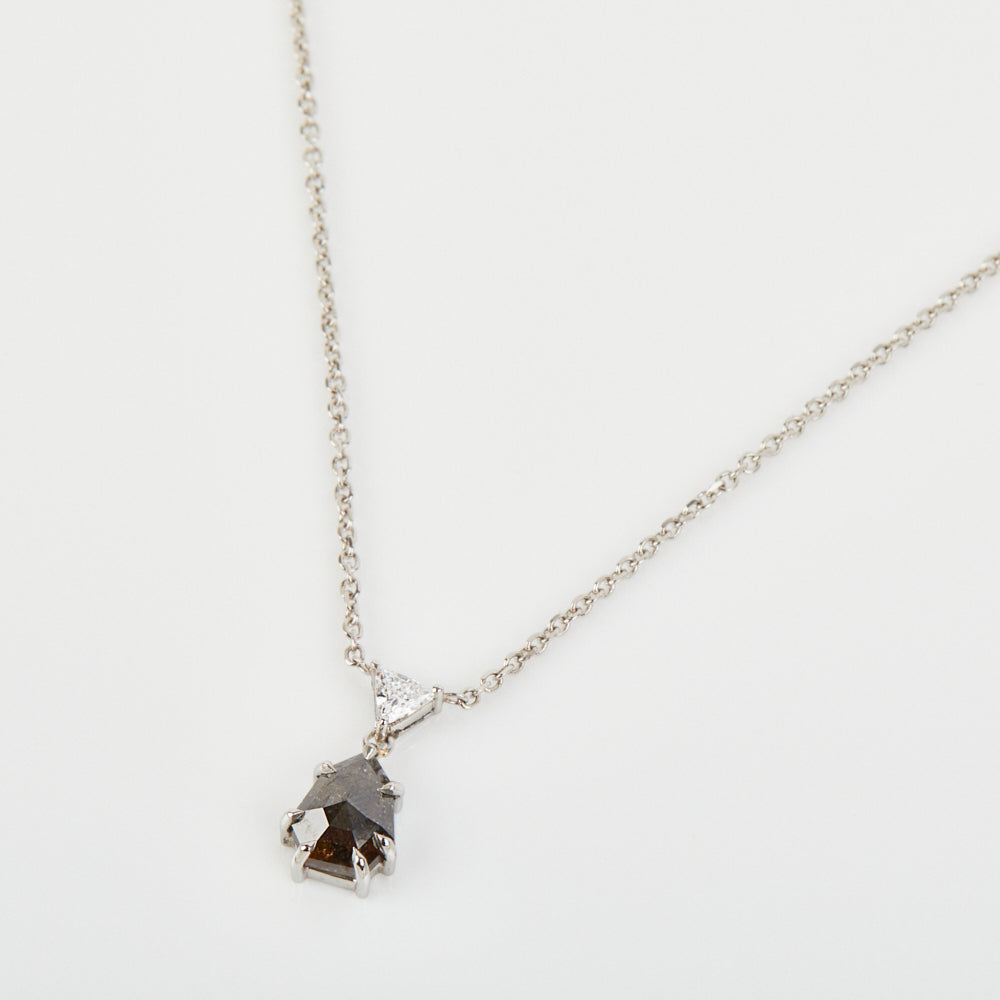 Black triangular salt and pepper diamond necklace in platinum.
