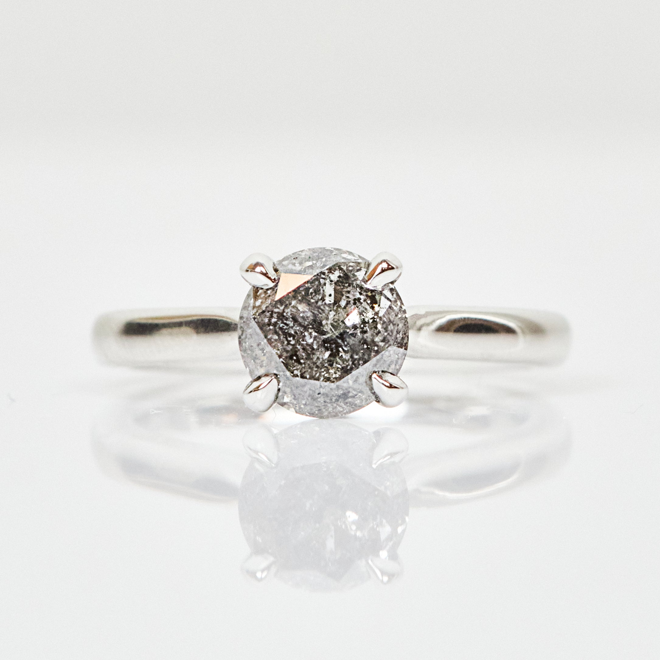 Platinum salt and pepper round brilliant cut diamond engagement solitaire ring