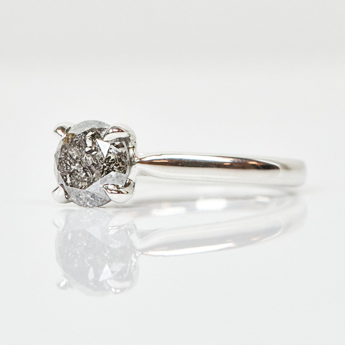 Platinum salt and pepper round brilliant cut diamond engagement solitaire ring
