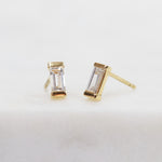 White baguette-cut lab-grown diamond earrings set in 18ct yellow gold.