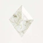 Kite-shaped rose-cut icy white salt and pepper diamond.