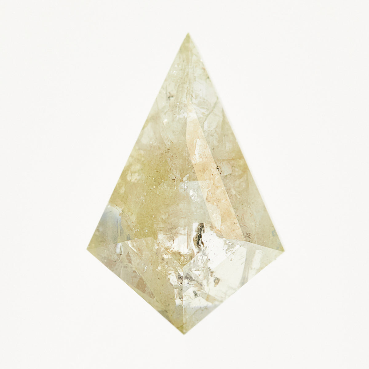 Kite-shaped rose-cut light grey diamond with yellow tones and speckled inclusions.