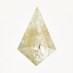 Kite-shaped rose-cut light grey diamond with yellow tones and speckled inclusions.