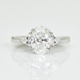 Platinum lab-grown oval diamond trilogy engagement ring