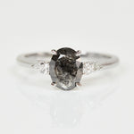 Platinum salt and pepper oval diamond engagement trilogy ring
