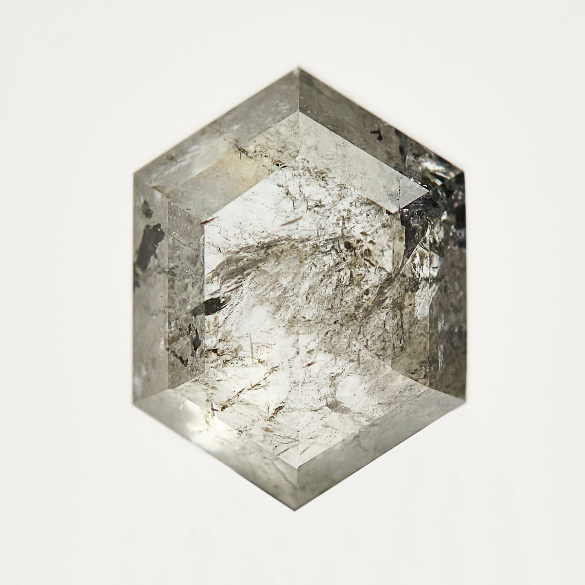 One-of-a-kind hexagon rose-cut salt and pepper diamond with unique inclusions.