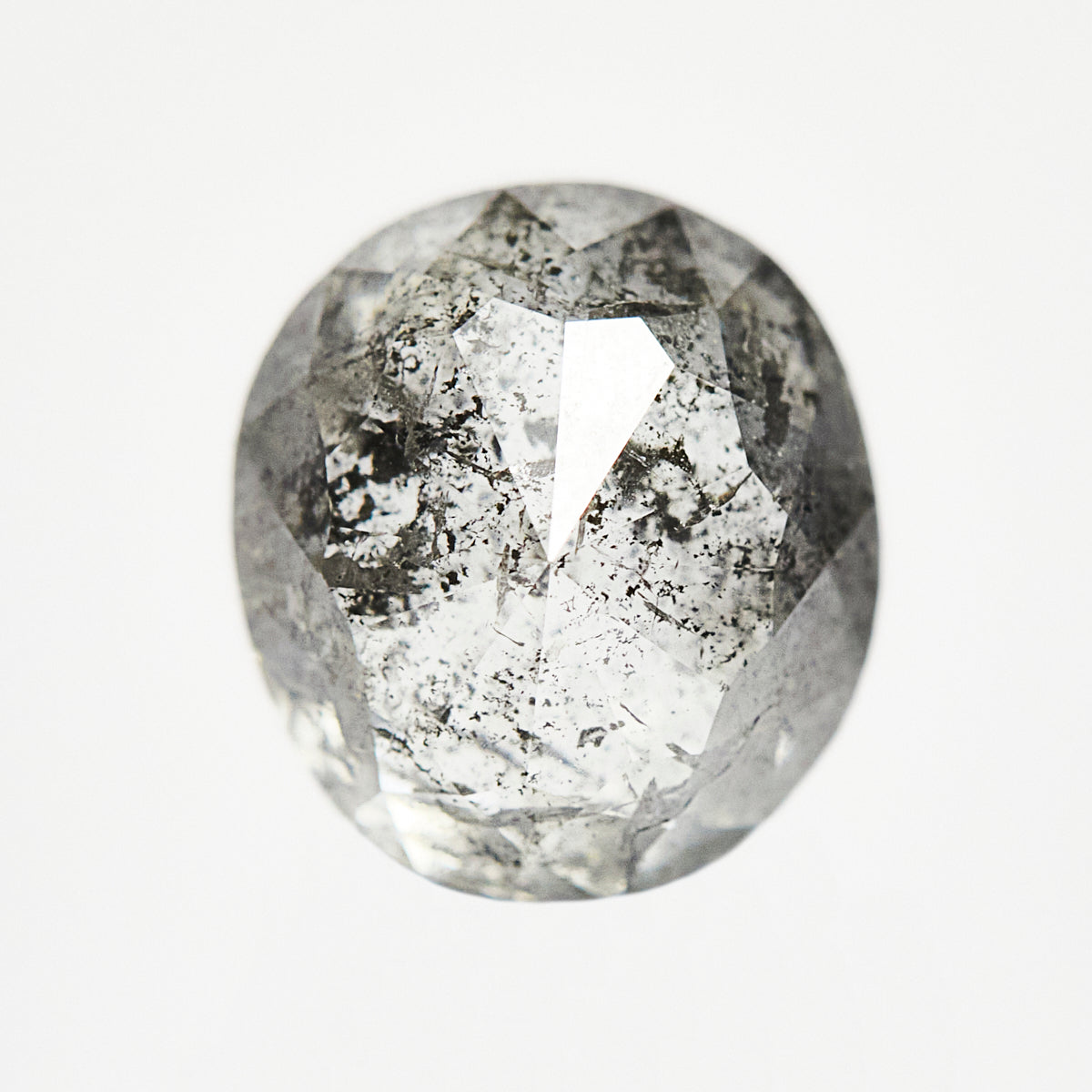 Handcrafted oval rose-cut natural salt and pepper diamond.