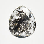 Modern pear-shaped rose-cut salt and pepper diamond with speckled inclusions.
