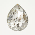 Handcrafted pear-shaped rose-cut salt and pepper diamond with speckled inclusions.