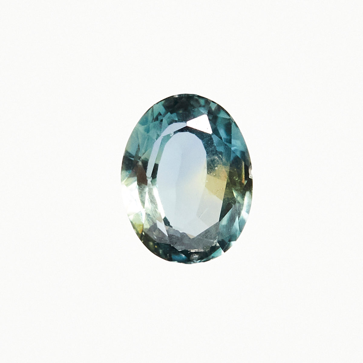 Timeless oval-cut natural teal sapphire gemstone.