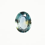 Timeless oval-cut natural teal sapphire gemstone.