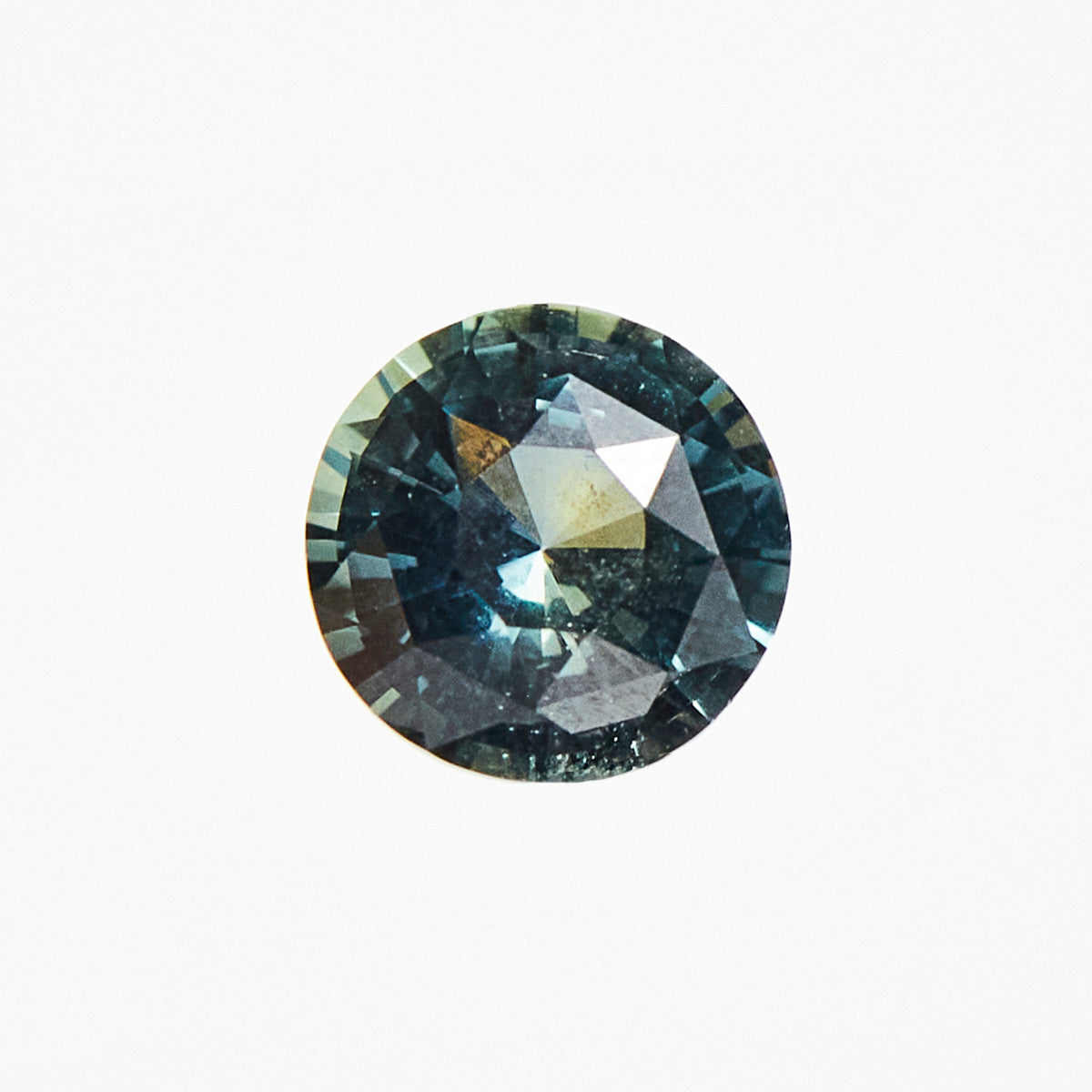 Ethical unheated round brilliant-cut teal sapphire gemstone.