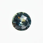 Ethical unheated round brilliant-cut teal sapphire gemstone.