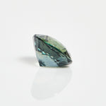 Ethical unheated round brilliant-cut teal sapphire gemstone.