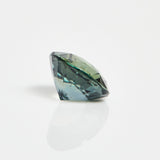Ethical unheated round brilliant-cut teal sapphire gemstone.