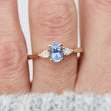blue sapphire yellow gold trilogy engagement ring