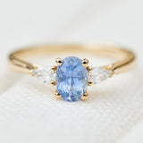 blue sapphire yellow gold trilogy engagement ring