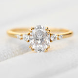 cushion cut moissanite and diamond engagement ring in yellow gold