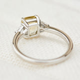 cushion cut yellow sapphire platinum trilogy engagement ring