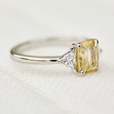 cushion cut yellow sapphire platinum trilogy engagement ring