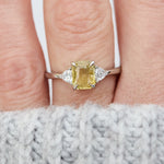 cushion cut yellow sapphire platinum trilogy engagement ring