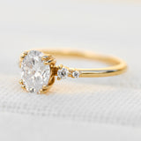 cushion cut moissanite and diamond engagement ring in yellow gold