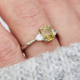 cushion cut yellow sapphire platinum trilogy engagement ring