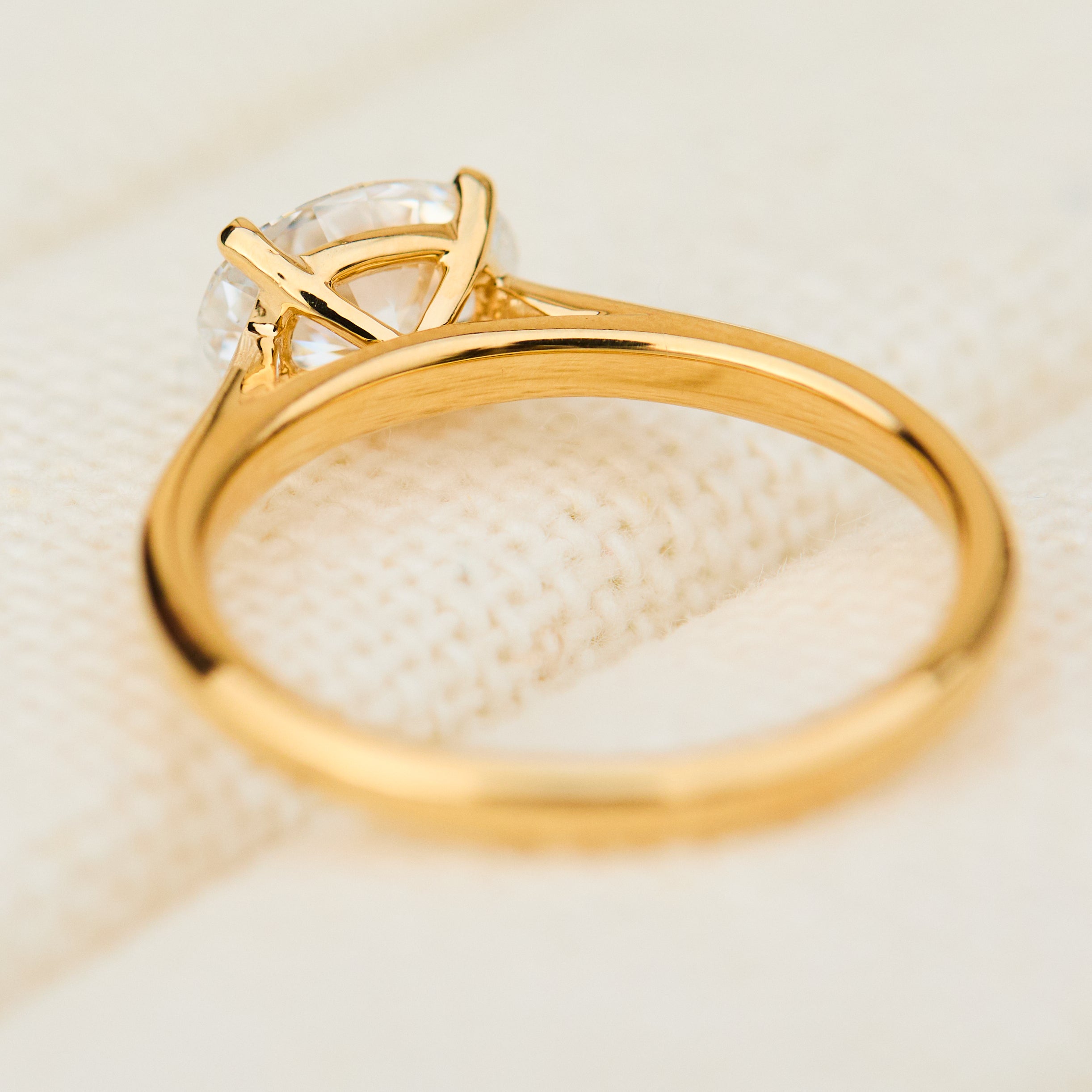 east west oval lab grown diamond engagement ring in yellow gold