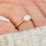 east west oval lab grown diamond engagement ring in yellow gold
