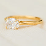 east west oval lab grown diamond engagement ring in yellow gold
