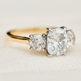 elongated cushion lab grown diamond trilogy engagement ring in yellow gold