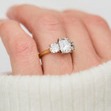 elongated cushion lab grown diamond trilogy engagement ring in yellow gold