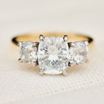elongated cushion lab grown diamond trilogy engagement ring in yellow gold