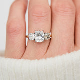 elongated cushion lab grown diamond trilogy engagement ring in yellow gold