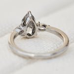 elongated pear shape salt and pepper diamond trilogy platinum engagement ring